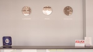 Three clocks labeled 'LONDON,' 'RIGA,' and 'MOSCOW' on a wall. - Kert (Riga)