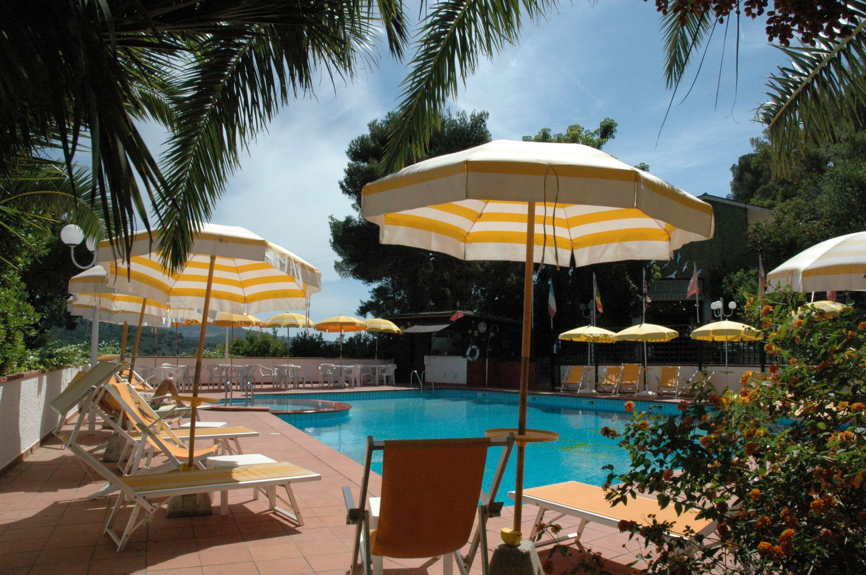 seasonal outdoor pool, open 8:00 am to 8:00 pm, pool umbrellas