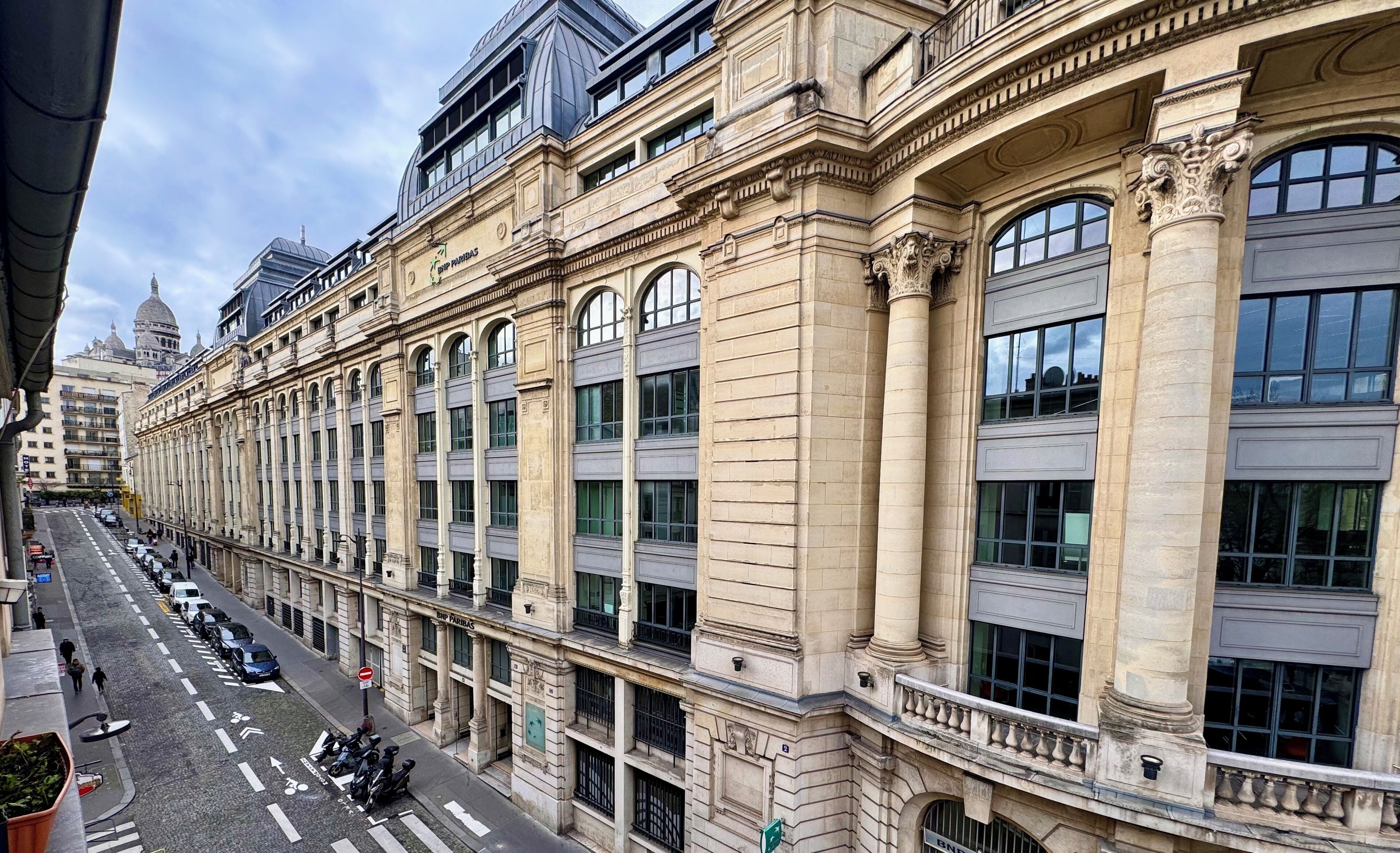 A historic building with classical architecture, large windows, and a prominent entrance.
