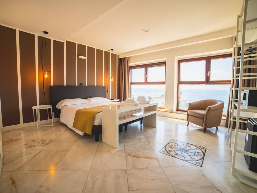 Junior Suite, Sea View | Minibar, desk, blackout drapes, soundproofing