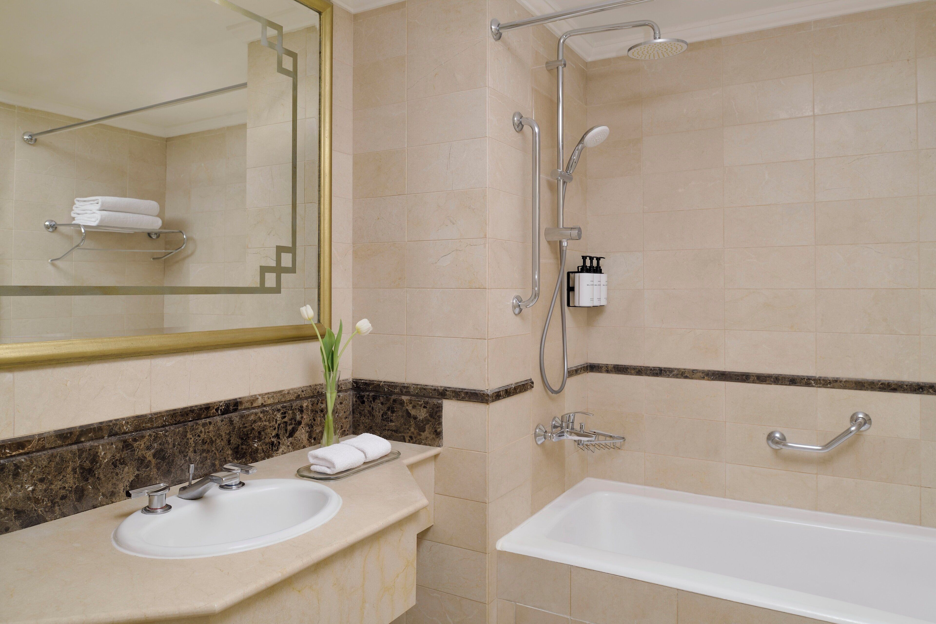 combined shower/bathtub, hair dryer, bathrobes, slippers