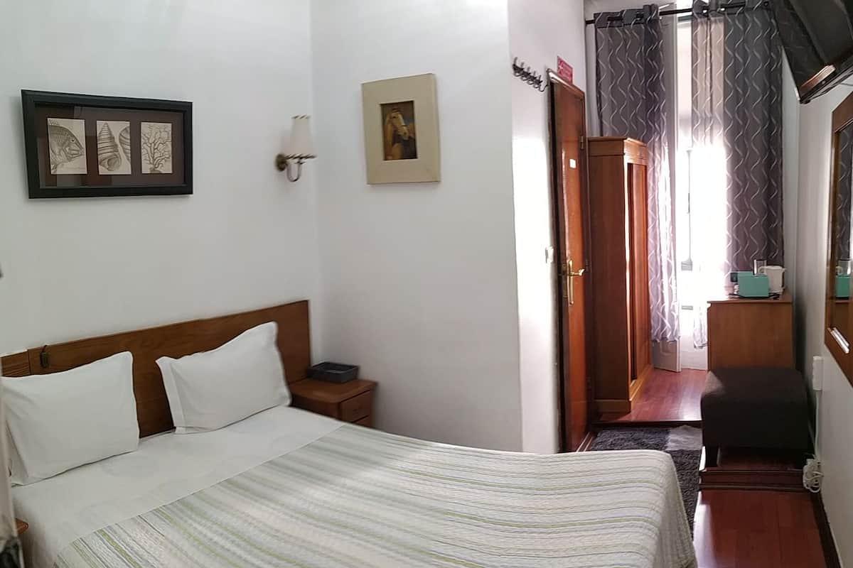 Economy Double Room | Minibar, desk, iron/ironing board, travel cot