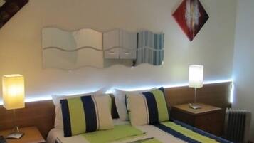 Minibar, desk, iron/ironing board, travel crib