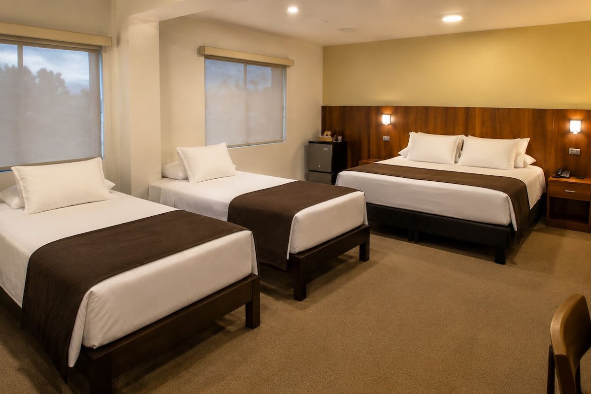 Quadruple Room, Garden View, Garden Area | Down comforters, minibar, in-room safe, desk