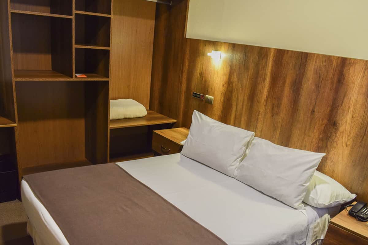 Economy Room | Down comforters, minibar, in-room safe, desk