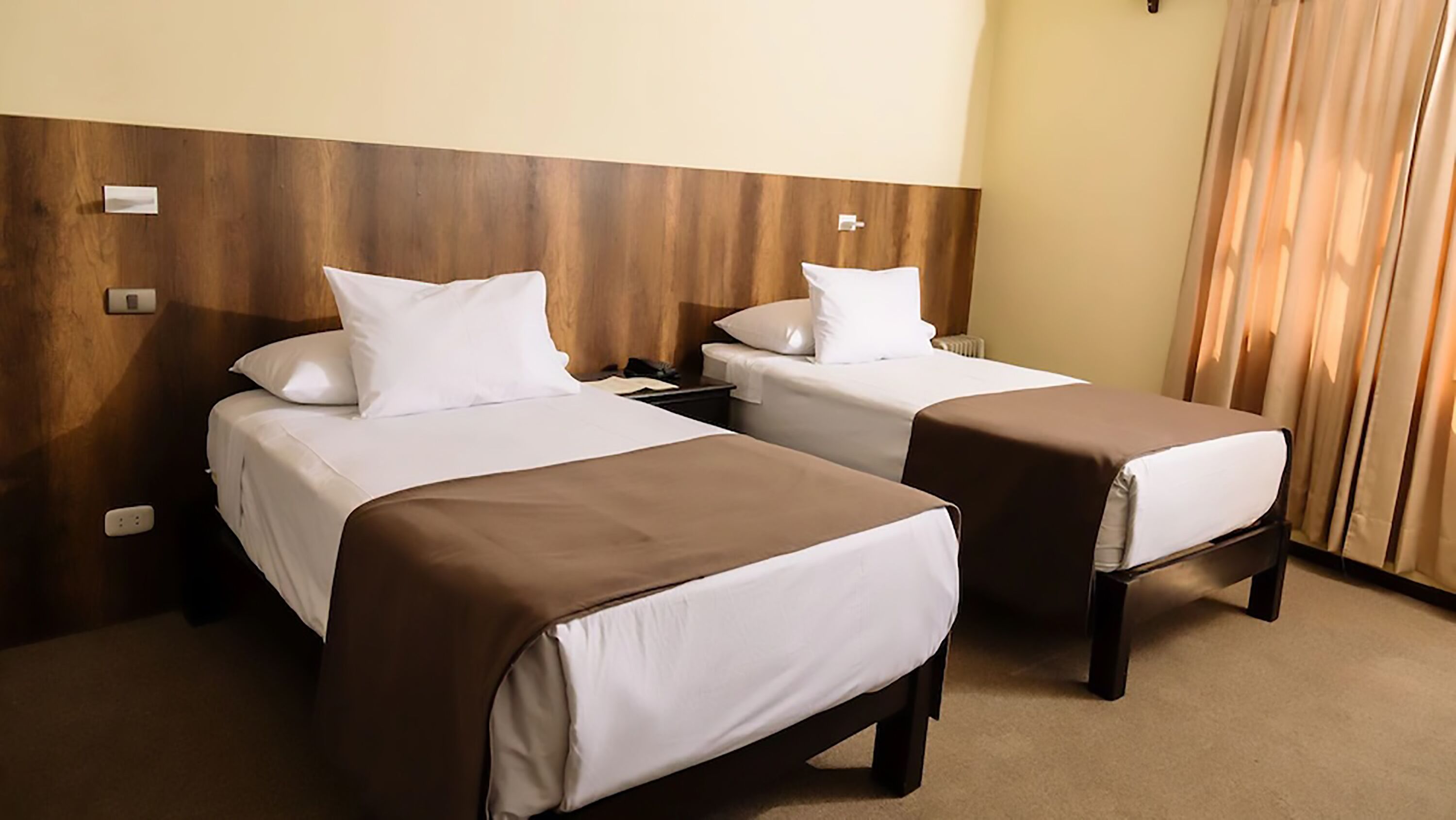 standard twin room | down duvets, minibar, in-room safe, individually decorated