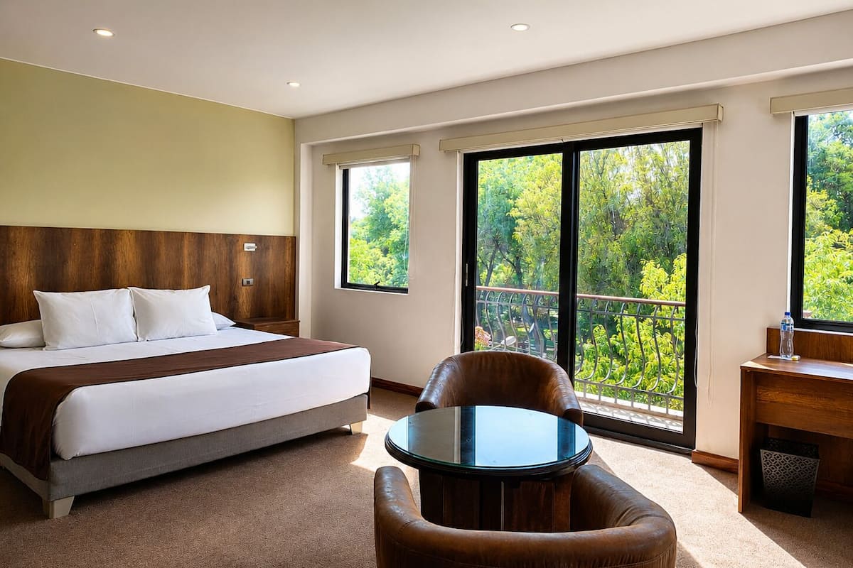 Studio Suite, Garden View, Garden Area | Down comforters, minibar, in-room safe, desk