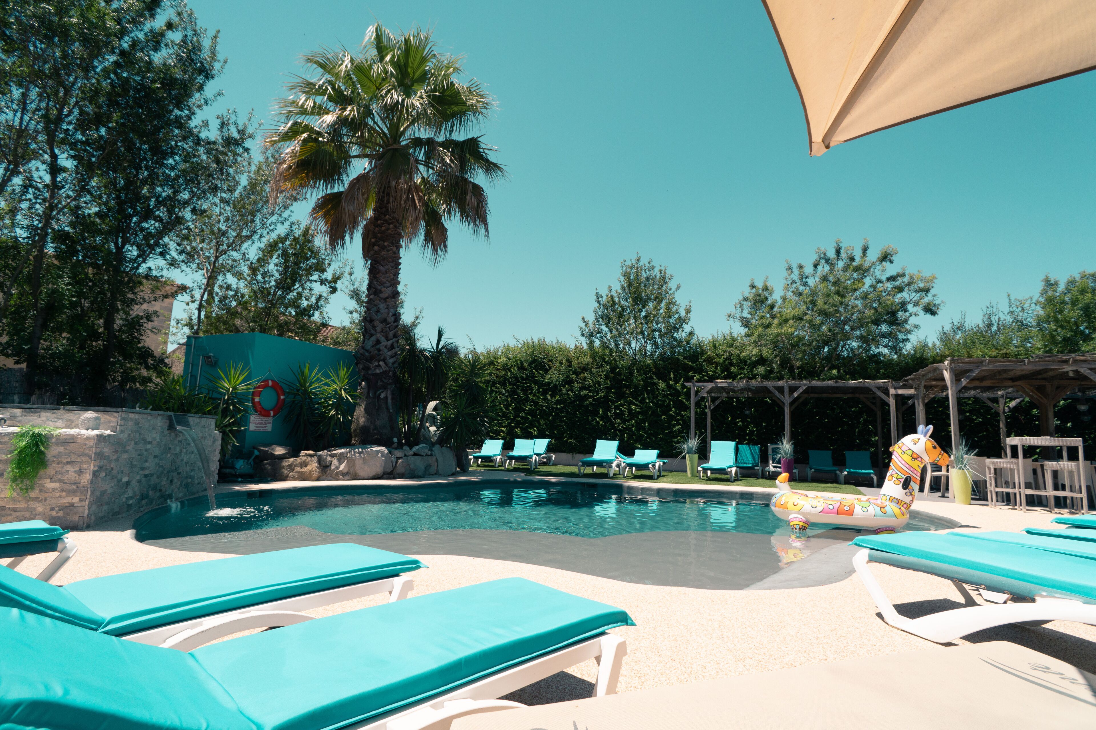 seasonal outdoor pool, pool umbrellas, pool loungers