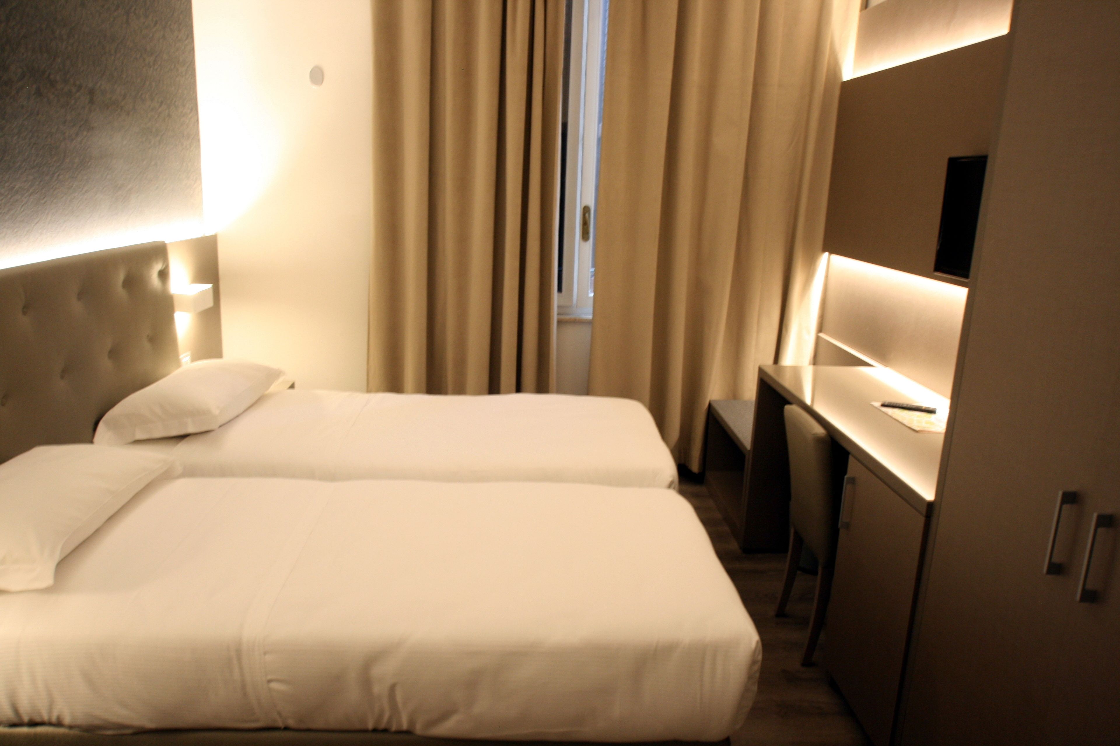 twin room | minibar, in-room safe, desk, blackout curtains