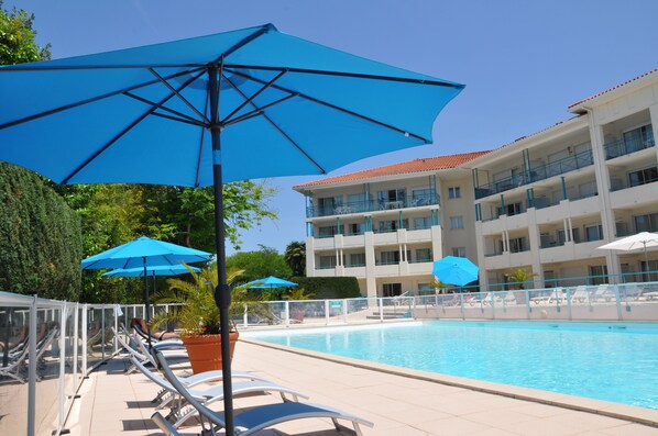 Outdoor pool, pool umbrellas, pool loungers