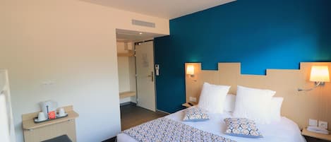 Family Quadruple Room, Ground Floor | In-room safe, desk, laptop workspace, blackout drapes