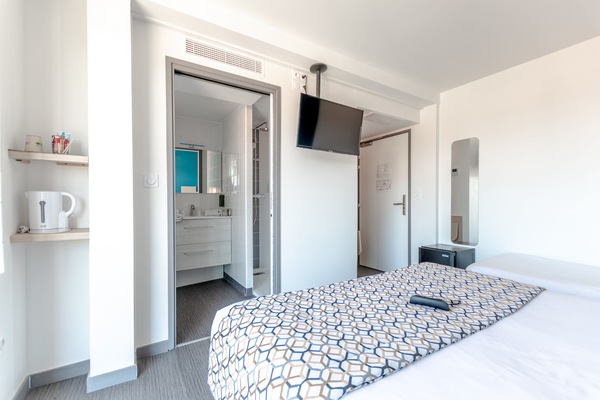 Triple Room, Balcony | In-room safe, desk, laptop workspace, blackout drapes