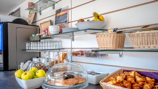 A breakfast buffet with various food items and glassware. - Sure Hotel by Best Western Saint-Raphael Le Dramont (Saint-Raphael)