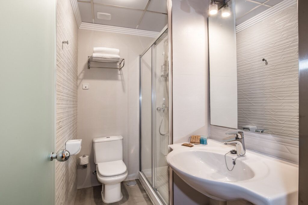 standard double room | bathroom | hair dryer, towels