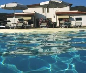 Outdoor pool, pool umbrellas, pool loungers