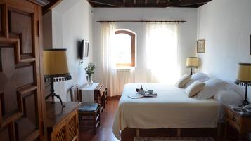 Egyptian cotton sheets, down duvets, Select Comfort beds, minibar