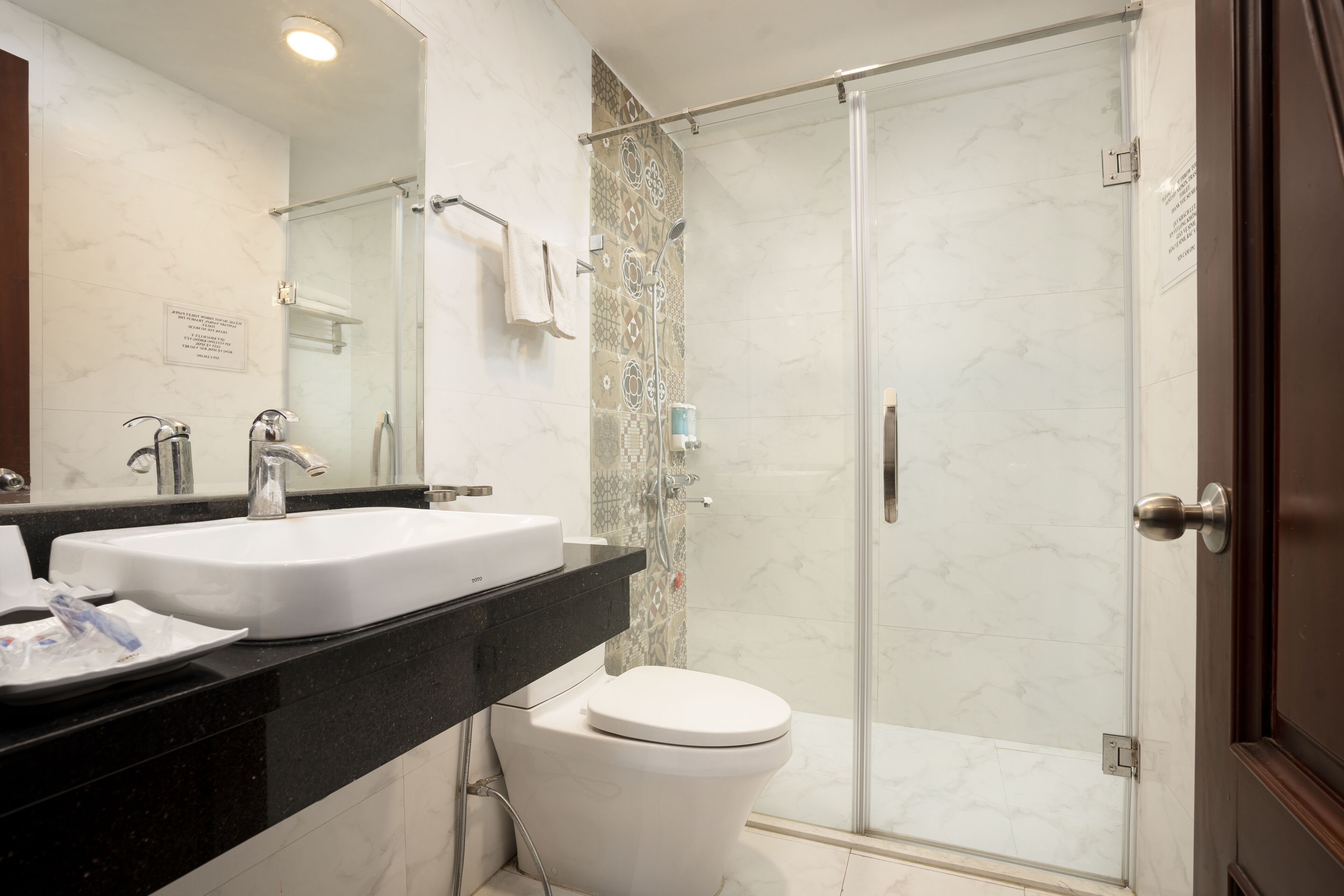 deluxe family room with balcony | bathroom | shower, rainfall showerhead, free toiletries, hair dryer