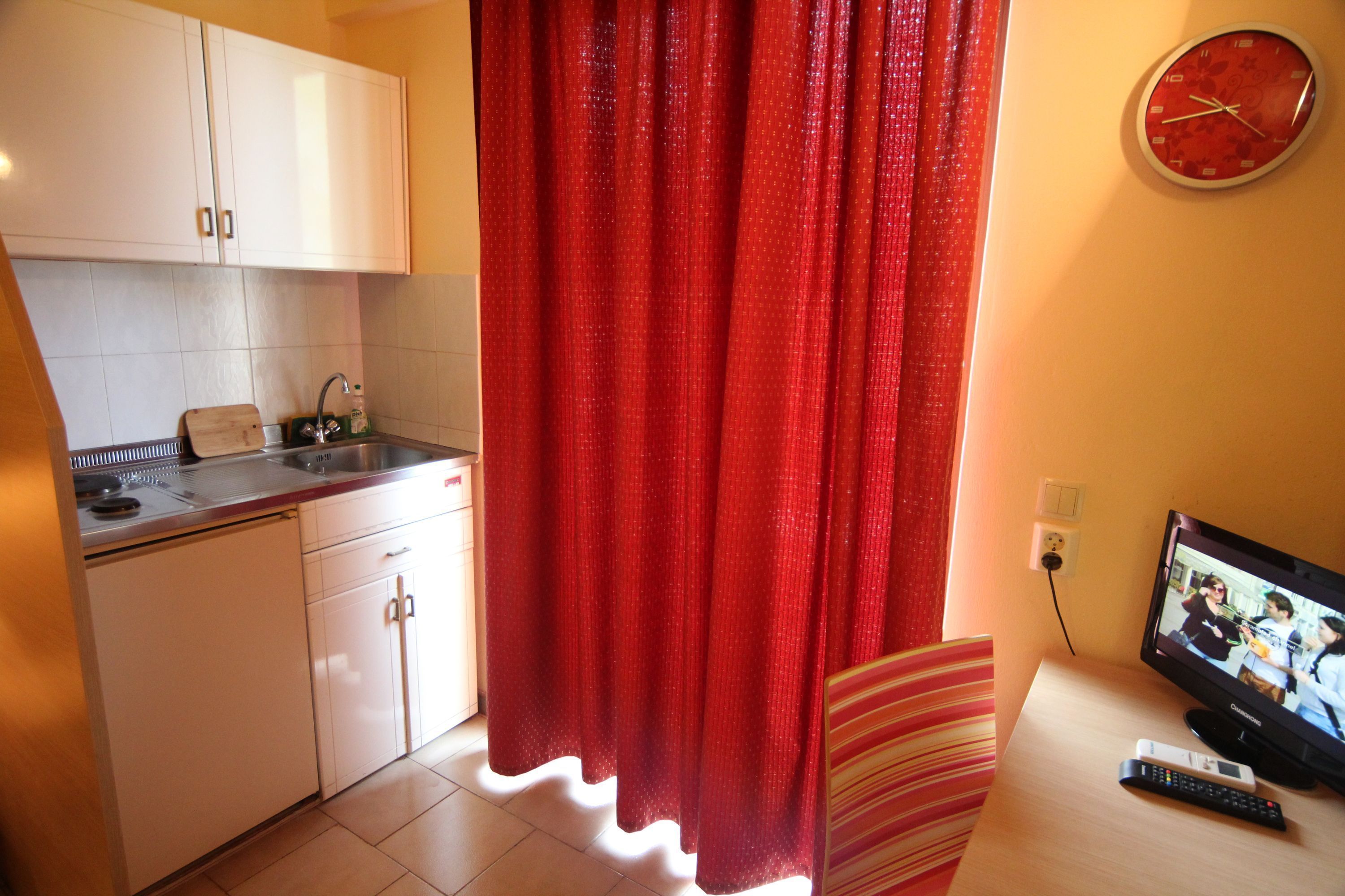 fridge, stovetop, electric kettle, cookware/dishes/utensils