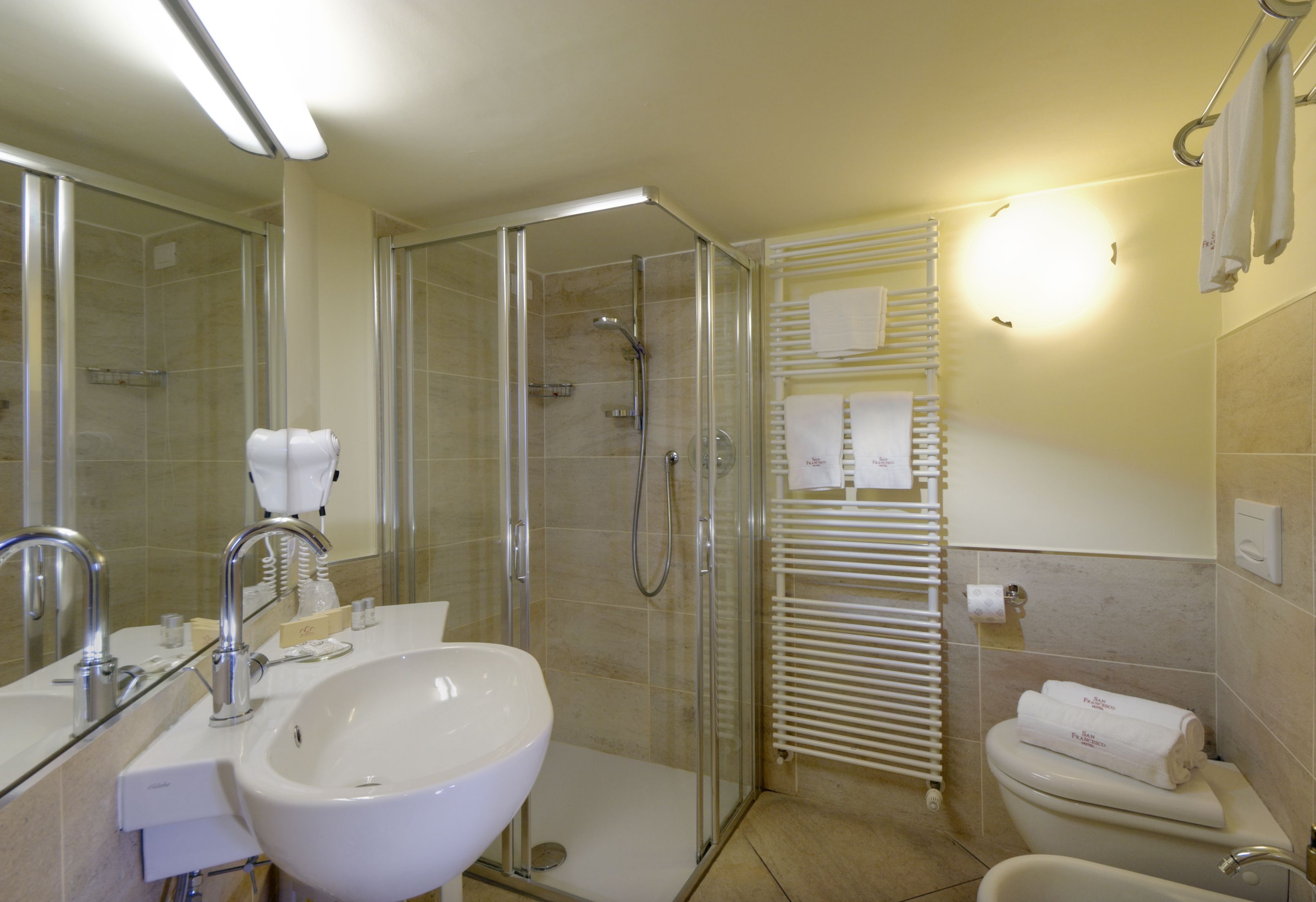 shower, free toiletries, hair dryer, towels