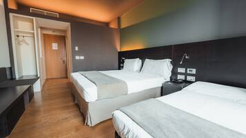 Superior Triple Room, Garden View | Minibar, in-room safe, desk, soundproofing