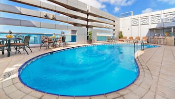 Outdoor pool, open 9:00 AM to 6:00 PM, pool loungers