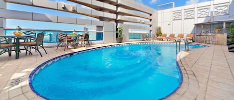 Outdoor pool, open 9:00 AM to 6:00 PM, pool loungers