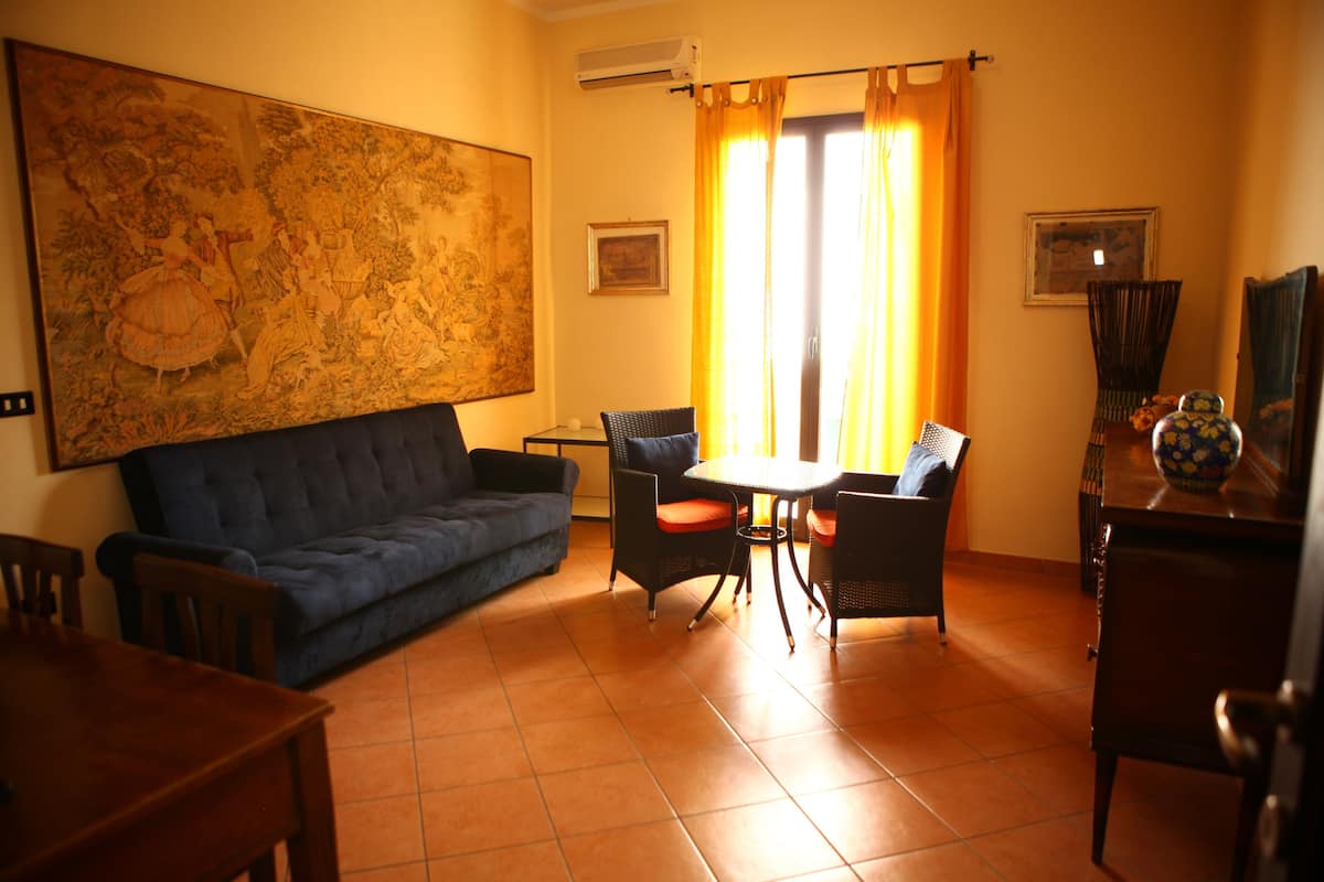 Family Room, Private Bathroom | Living area | TV