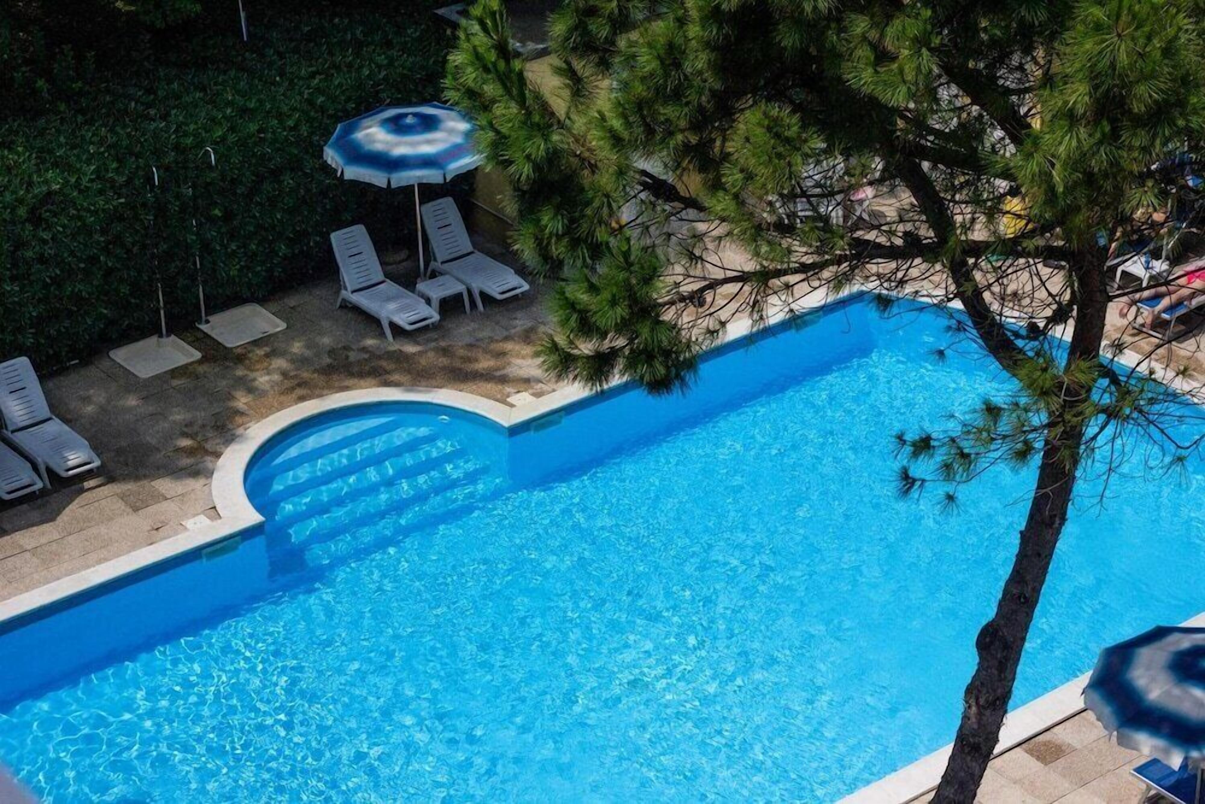 Outdoor pool, pool umbrellas, pool loungers