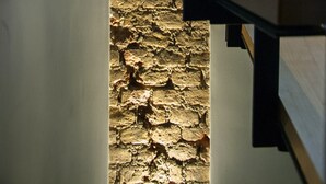 A modern staircase with a stone wall at the base. - I'zaz (Istanbul)