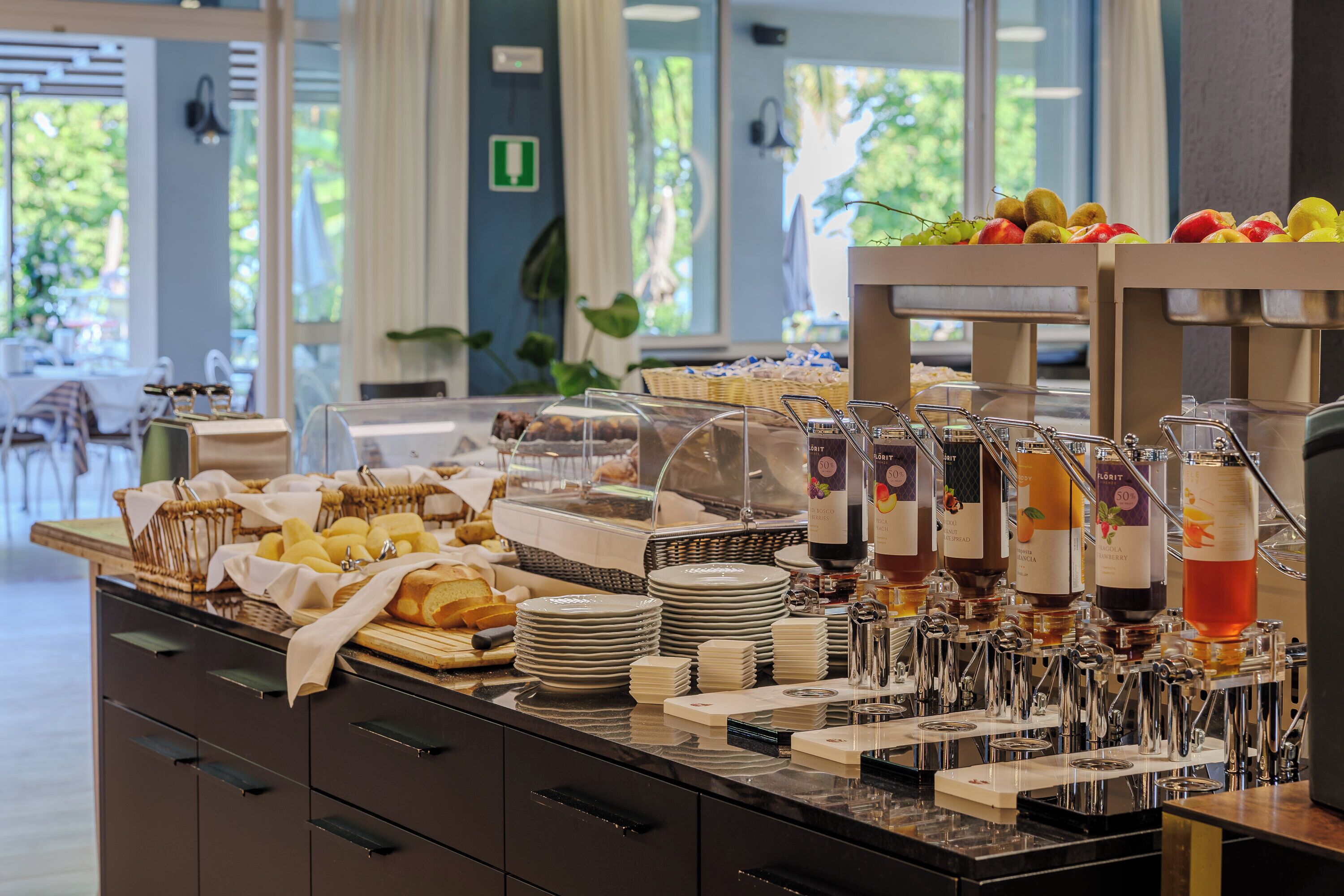 A buffet with various food items and beverages.