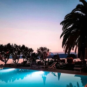 Outdoor pool, open 8:00 AM to 8:00 PM, pool umbrellas, pool loungers