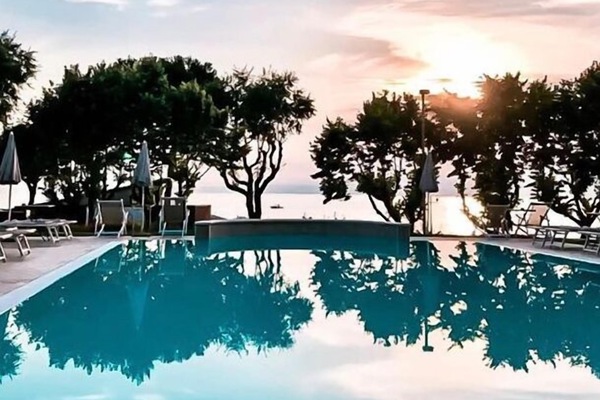 Outdoor pool, open 8:00 AM to 8:00 PM, pool umbrellas, sun loungers