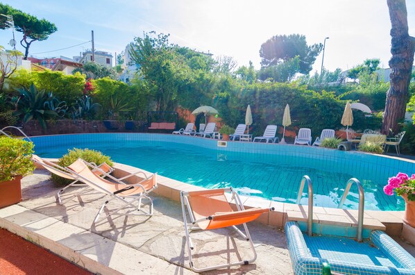 Outdoor pool, pool umbrellas, pool loungers