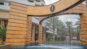 A building with a large water feature and a sign with a capital 'I'. - InterContinental Jeddah by IHG (Jeddah)