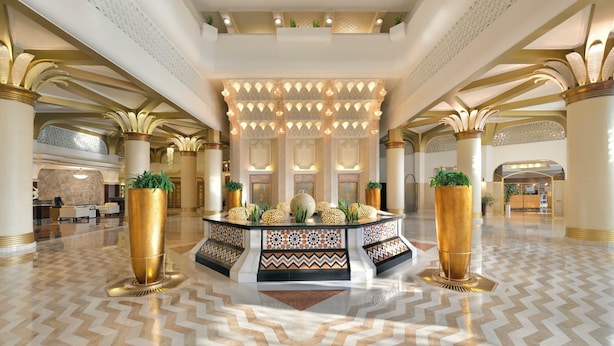A spacious lobby with a central island, large columns, and a high ceiling with intricate patterns. - InterContinental Jeddah by IHG (Jeddah)