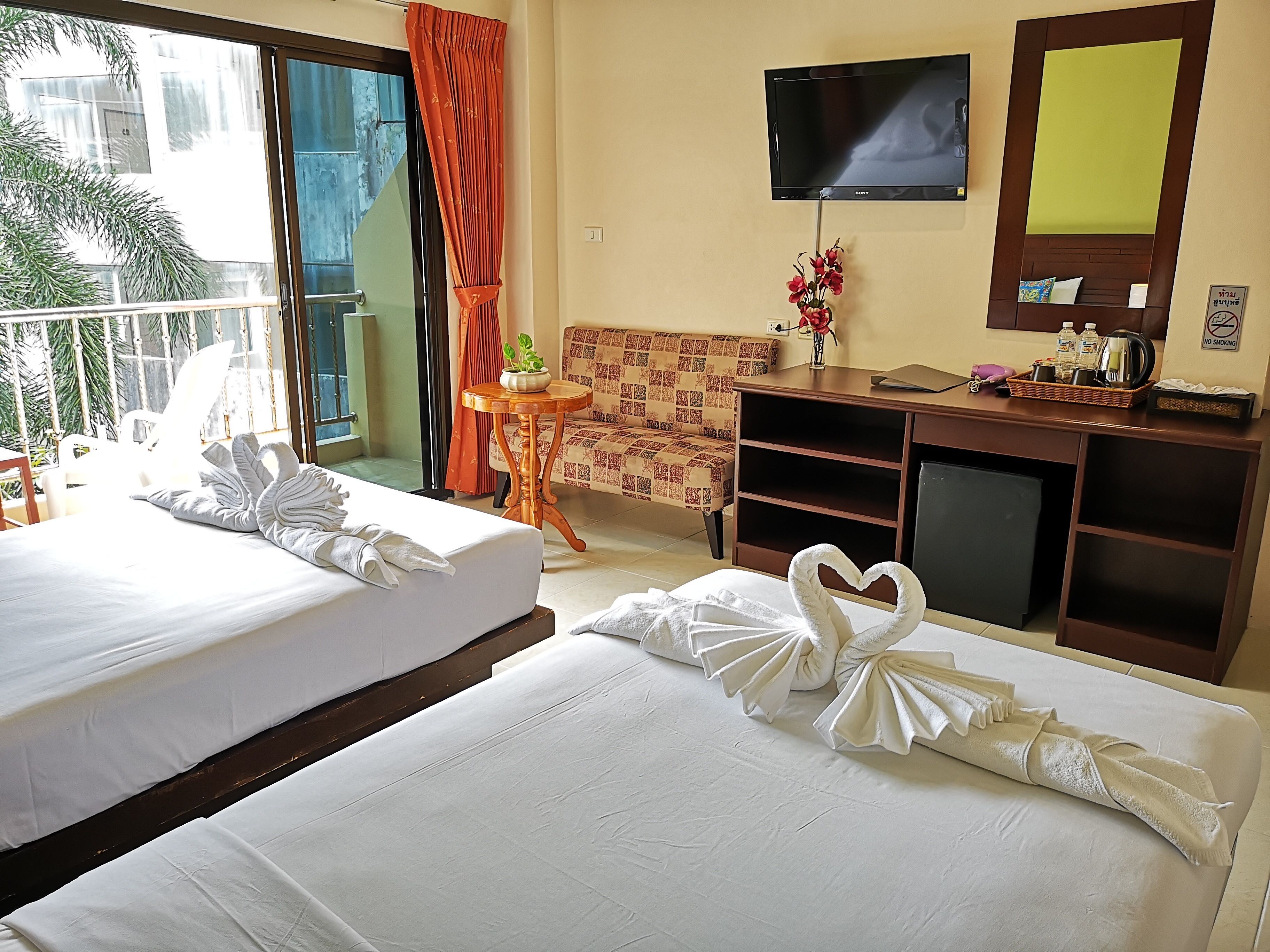 standard double room, 2 single beds, balcony, pool view | living area | 32-inch lcd tv with cable channels, tv