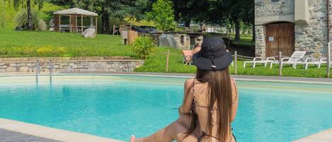 Seasonal outdoor pool, open 10:00 AM to 6:00 PM, sun loungers