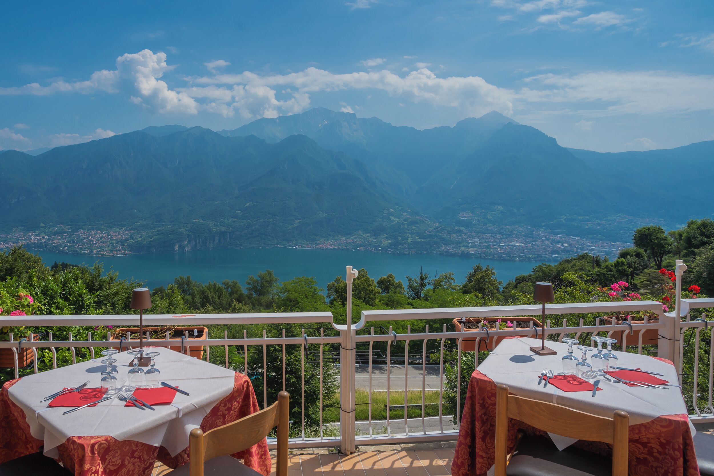 A table set for dining with a mountain view.
