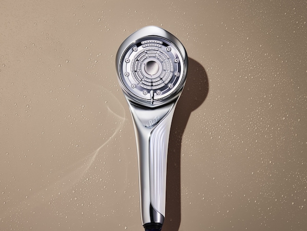 A showerhead with a metallic finish and a circular base.