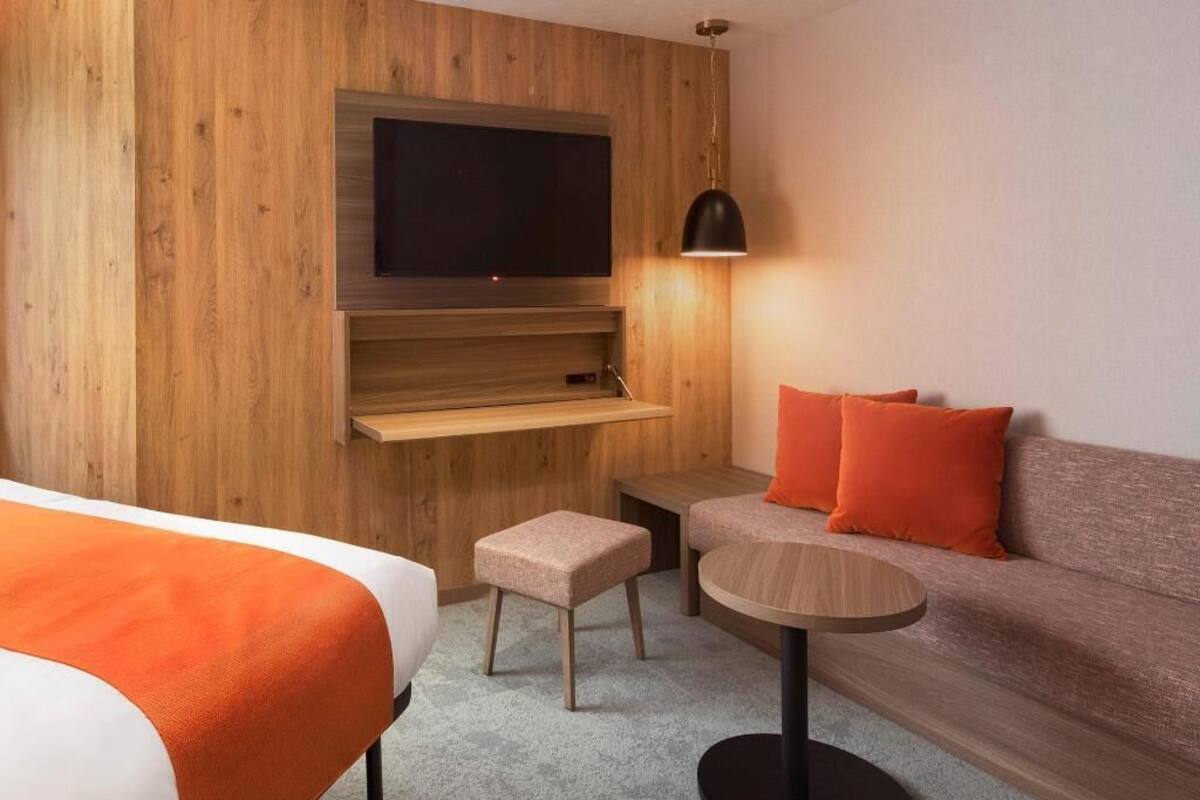 Down comforters, desk, blackout drapes, iron/ironing board