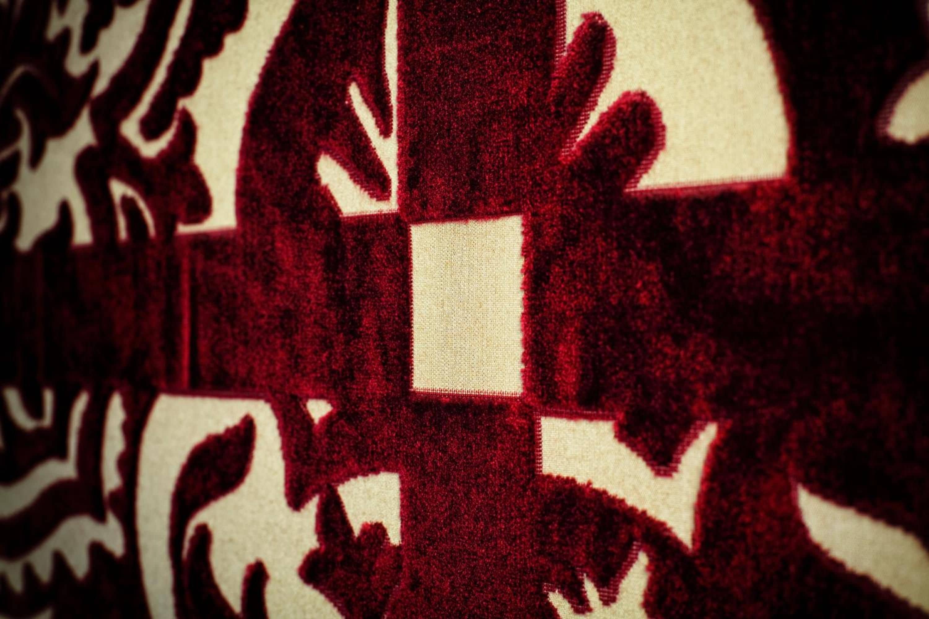 A close-up of a patterned fabric with a central square design.
