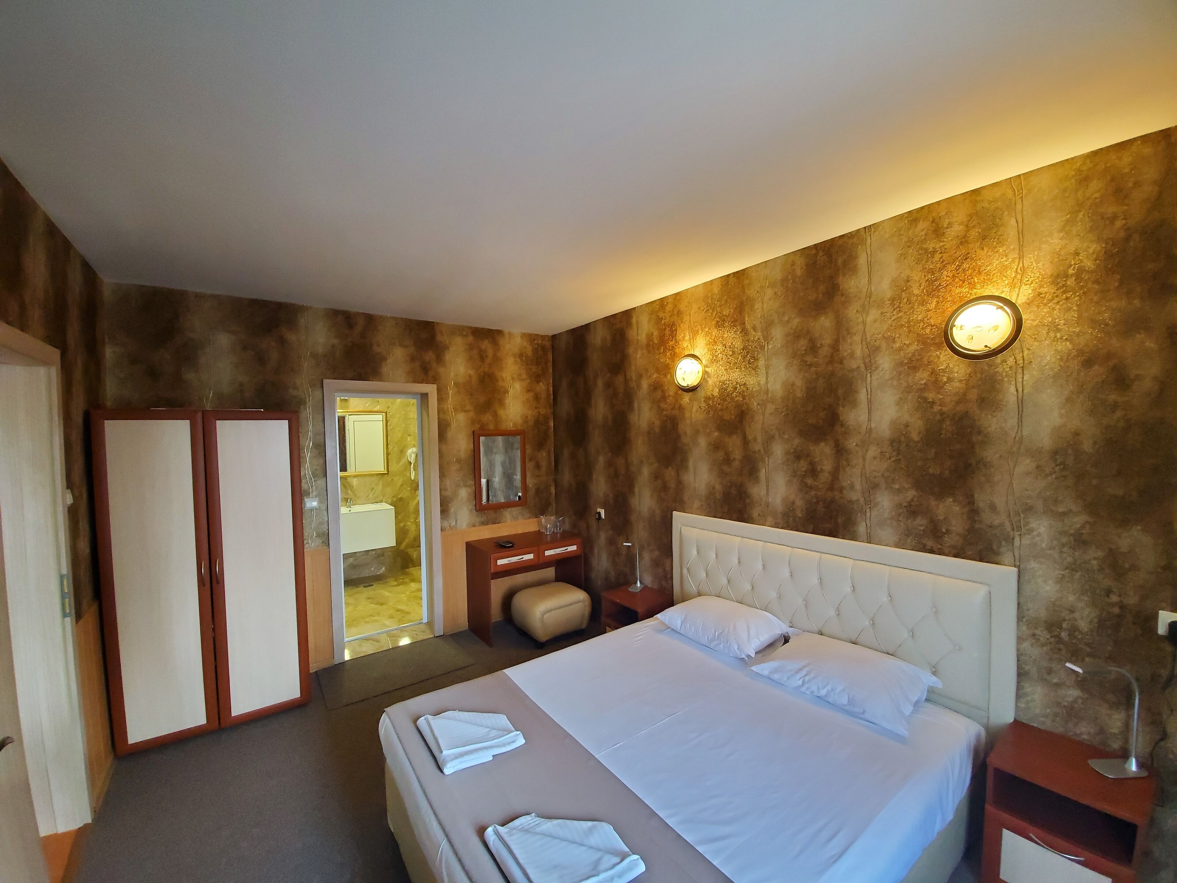 Standard Apartment, 1 Bedroom | Minibar, in-room safe, desk, iron/ironing board