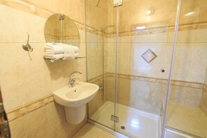 Shower, free toiletries, towels, soap