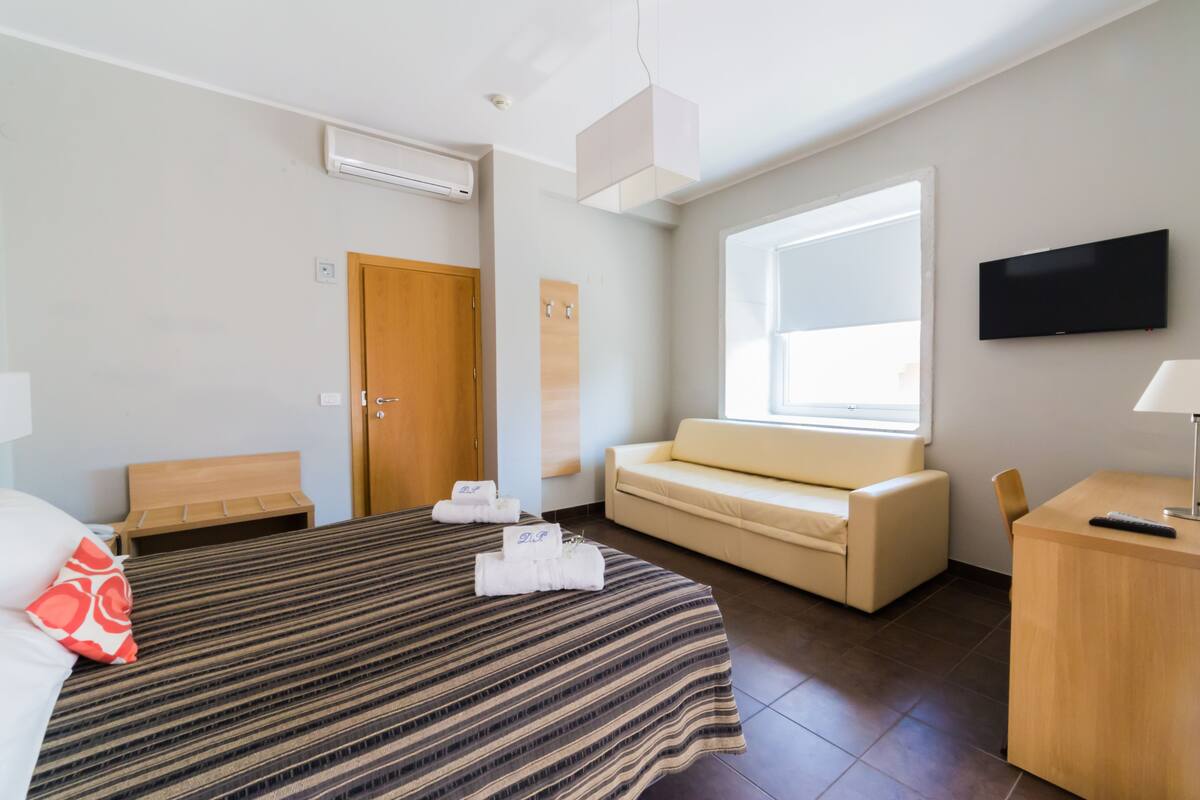 triple room, 1 queen bed with sofa bed | in-room safe, desk, rollaway beds, free wifi