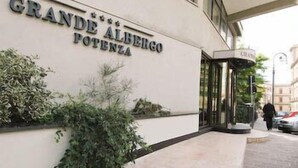 The exterior of Grande Albergo Potenza with a clear entrance and a glass canopy.
