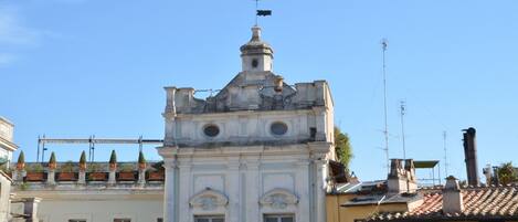 A historic building with a central dome and a bell tower.