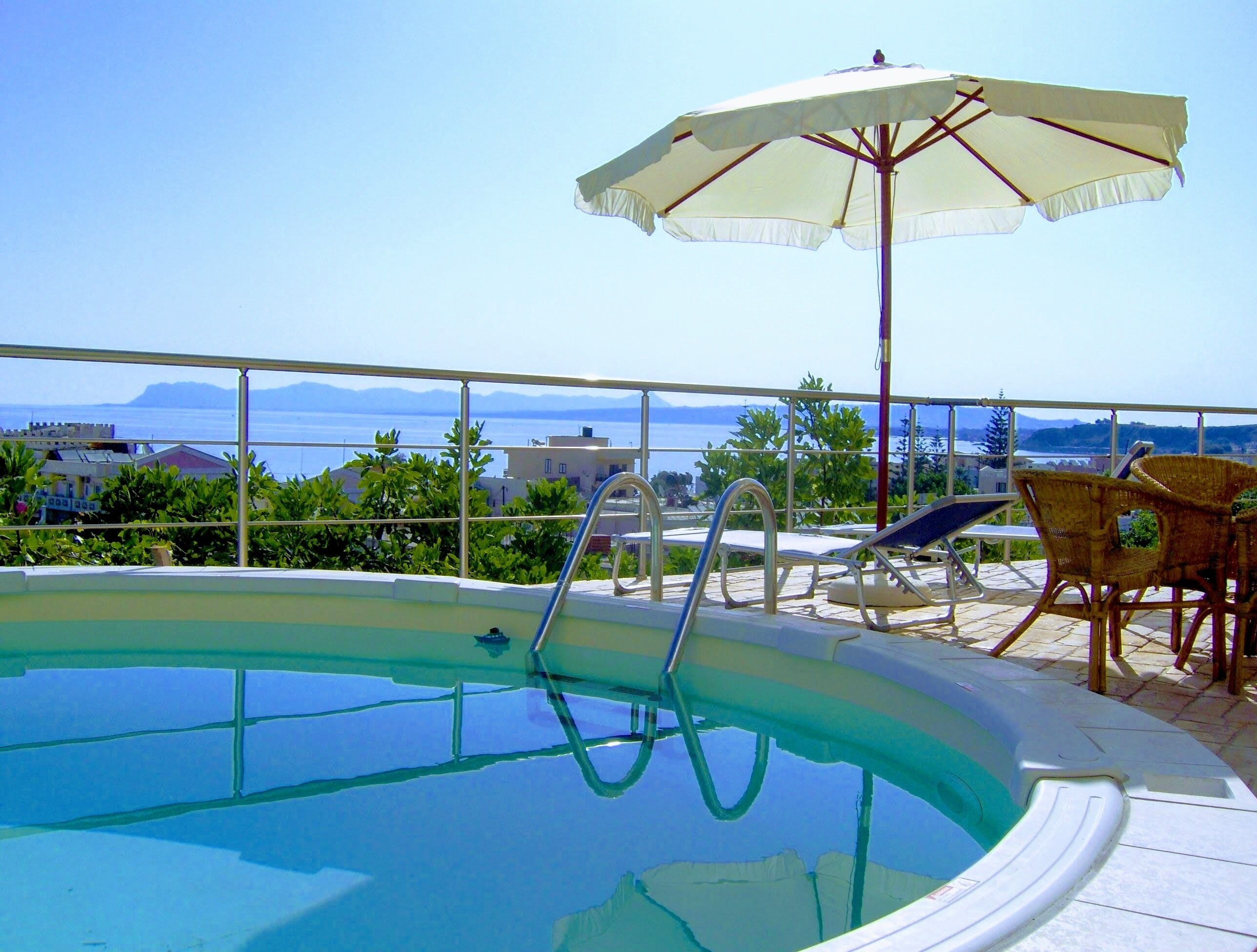Outdoor pool, an infinity pool, open open 24 hours a day, pool umbrellas