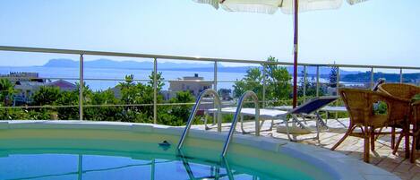 Outdoor pool, an infinity pool, open open 24 hours a day, pool umbrellas