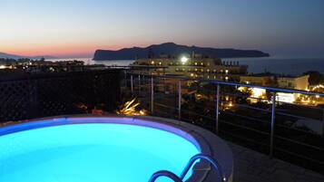 Outdoor pool, an infinity pool, open open 24 hours, pool umbrellas