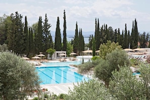 Indoor pool, outdoor pool, pool umbrellas, pool loungers - Eretria Village Resort & Conference Center (Eretria)